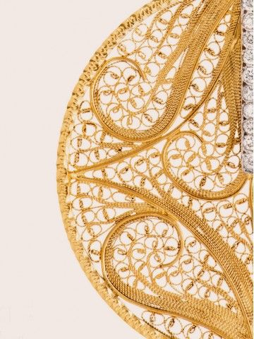 Deco Filigree collection by Eleuterio, crafted in 19.2k gold and featuring hand-made filigree in Portugal. 